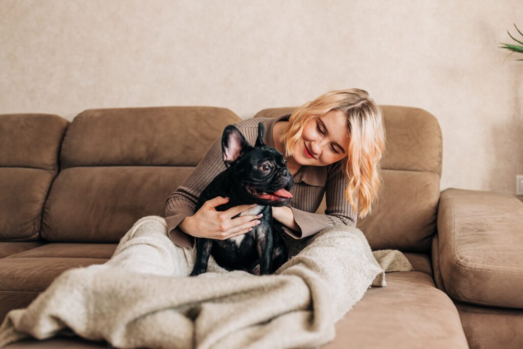 young-woman-holding-french-bulldog-puppy-on-her-ha-2022-03-02-22-18-06-utc